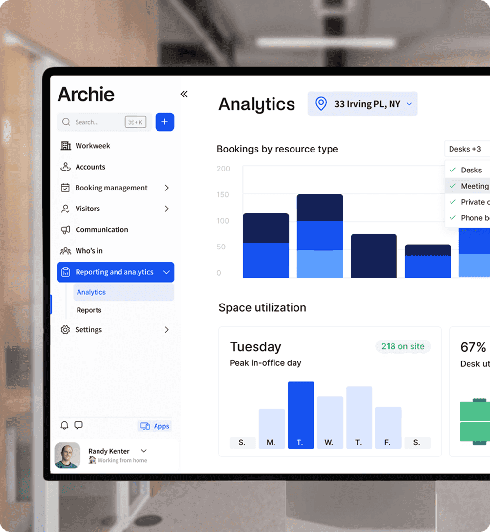 A laptop screen displaying the Archie app's analytics dashboard, showing bookings by resource type and space utilization statistics.